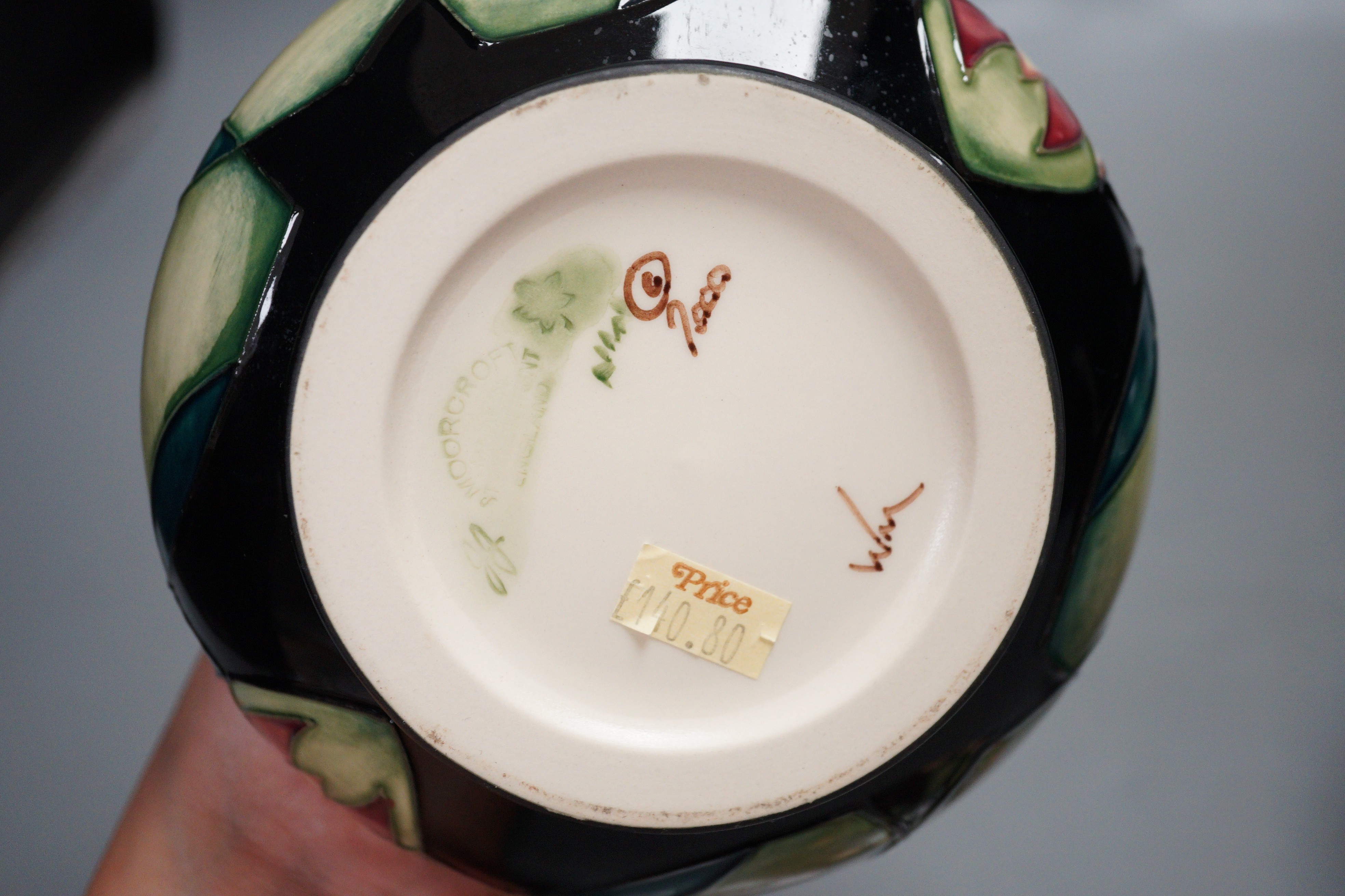 A Moorcroft pottery squat shaped vase and lidded ginger jar, decorated in the 